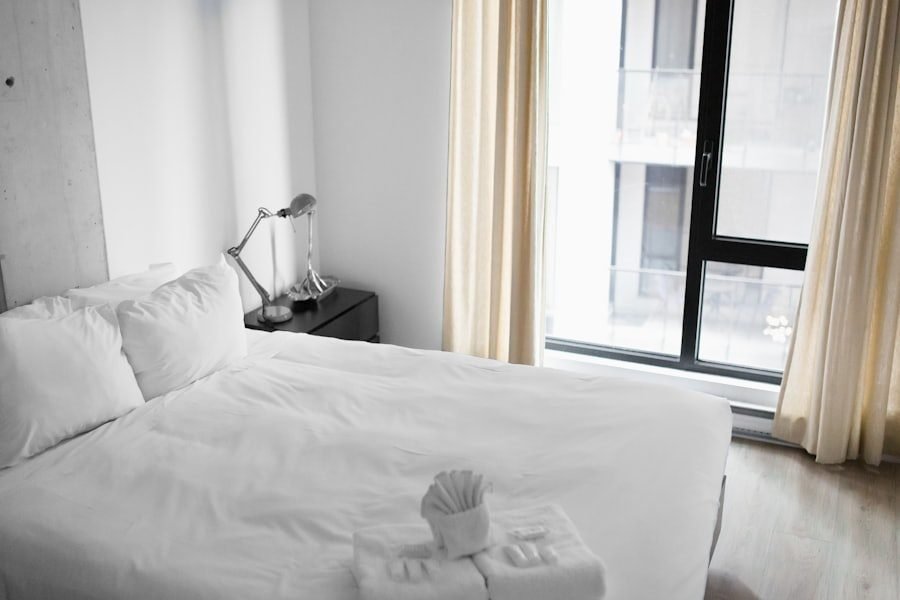 Freshly turned-over short-term rental bedroom with clean linens and folded towels