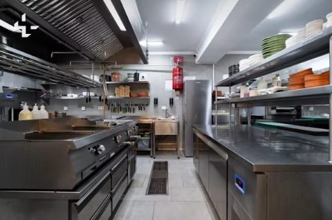 Clean stainless steel commercial kitchen prepared for a health inspection